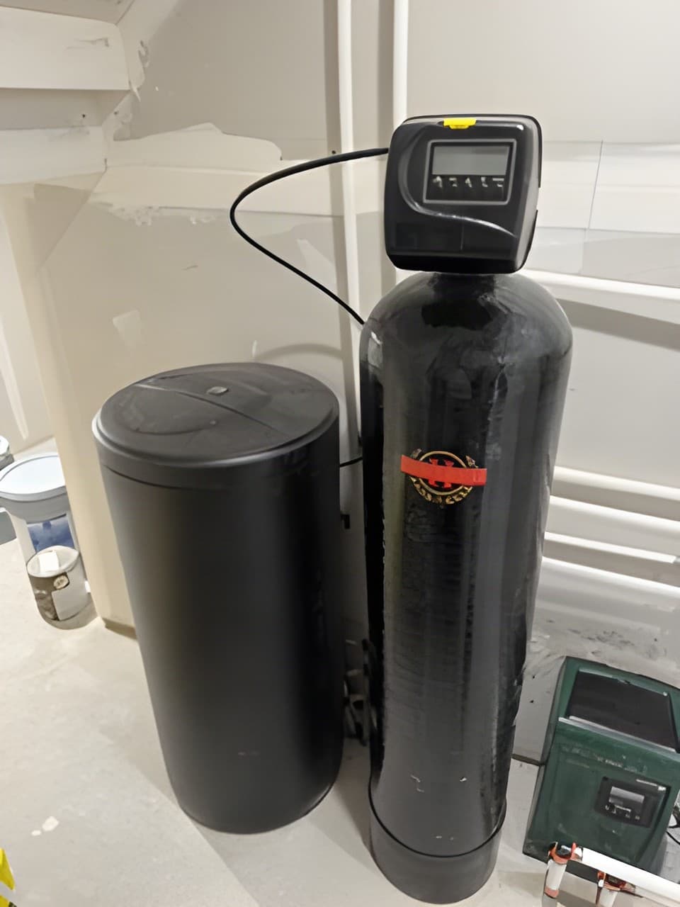 Installed water softener system with brine tank